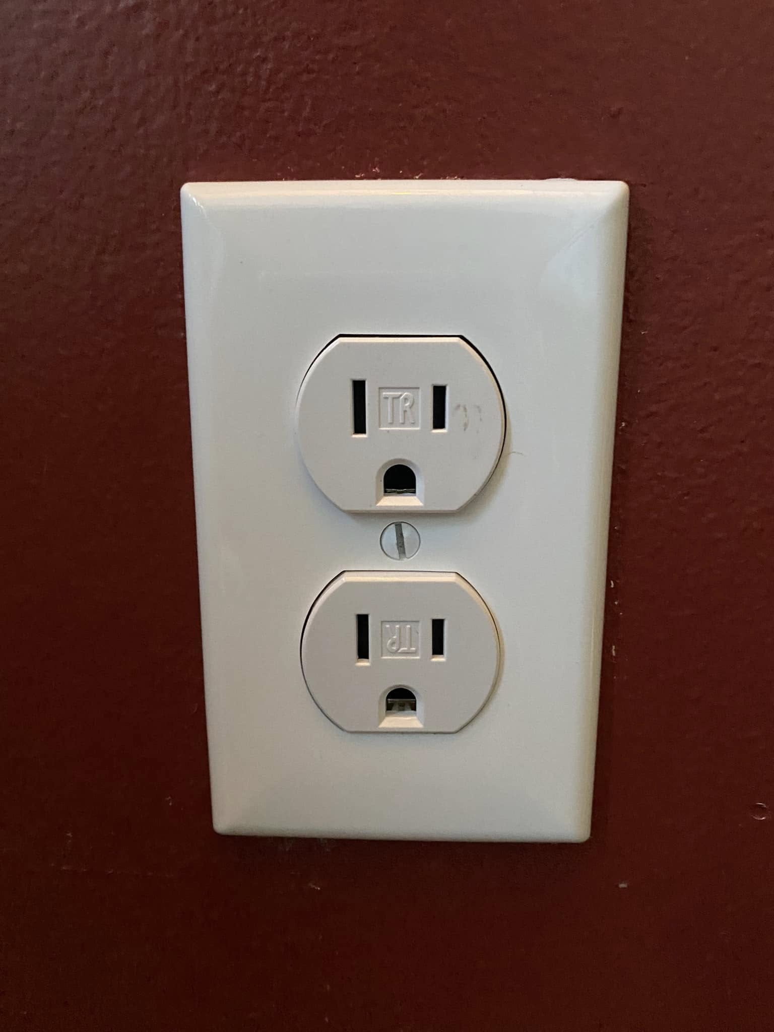 Tamper-resistant receptacle on an oxblood wall