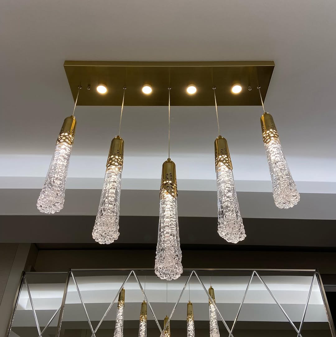 Brass pendant cluster in a finished dining room